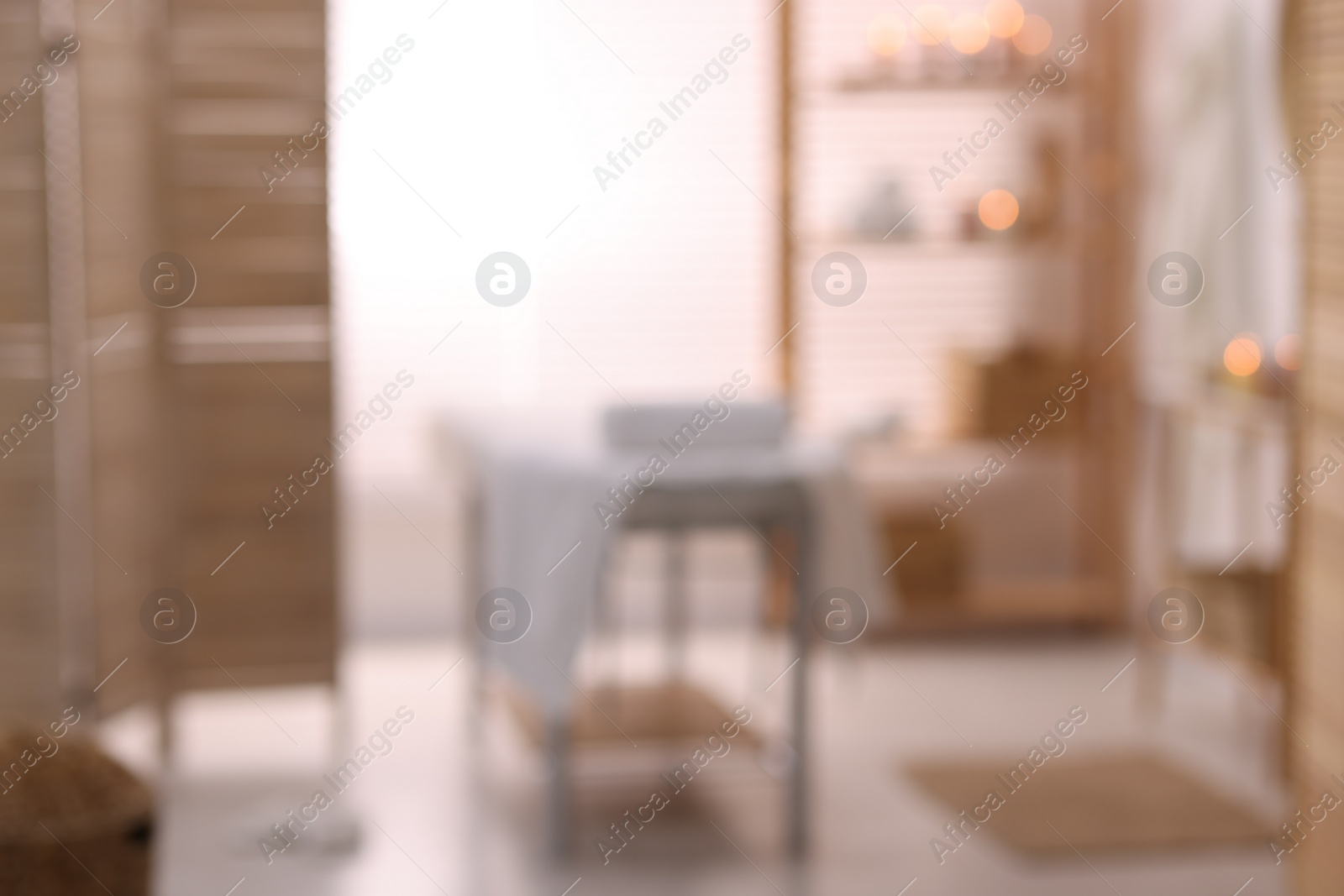 Photo of Cozy massage room with equipment, blurred view