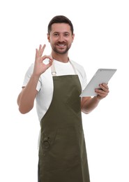 Photo of Smiling man with tablet showing ok gesture on white background