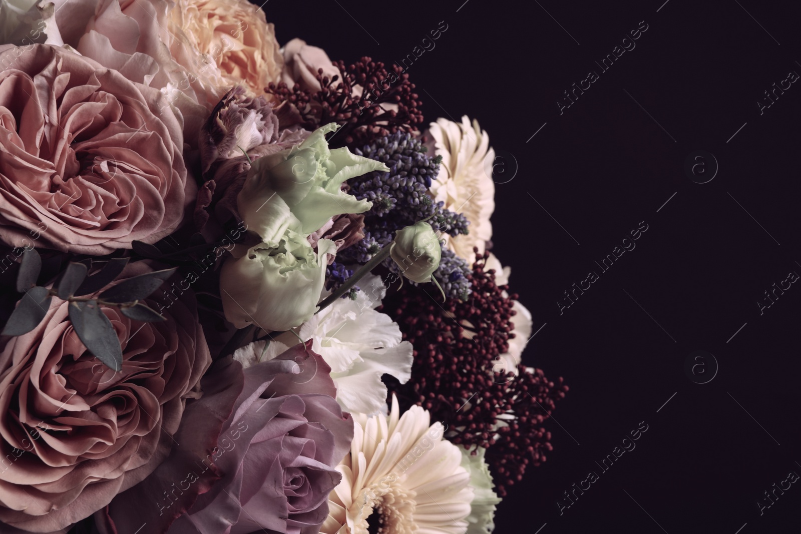 Photo of Beautiful bouquet on black background. Floral card design with dark vintage effect