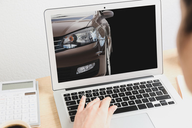 Image of Buying online. Woman choosing car using laptop, closeup view