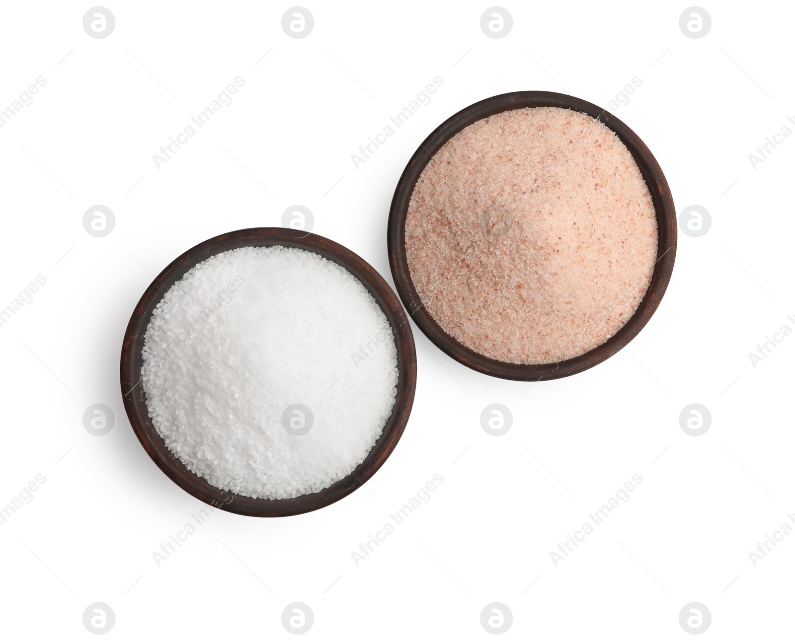 Photo of Different types of natural salt in bowls isolated on white, top view