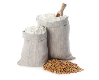 Photo of Sacks with flour and grains on white background