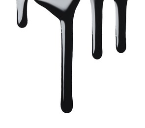 Photo of Black glossy oil flowing on white background