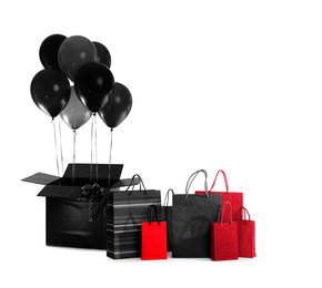 Image of Black Friday concept. Bunch of balloons and shopping bags on white background