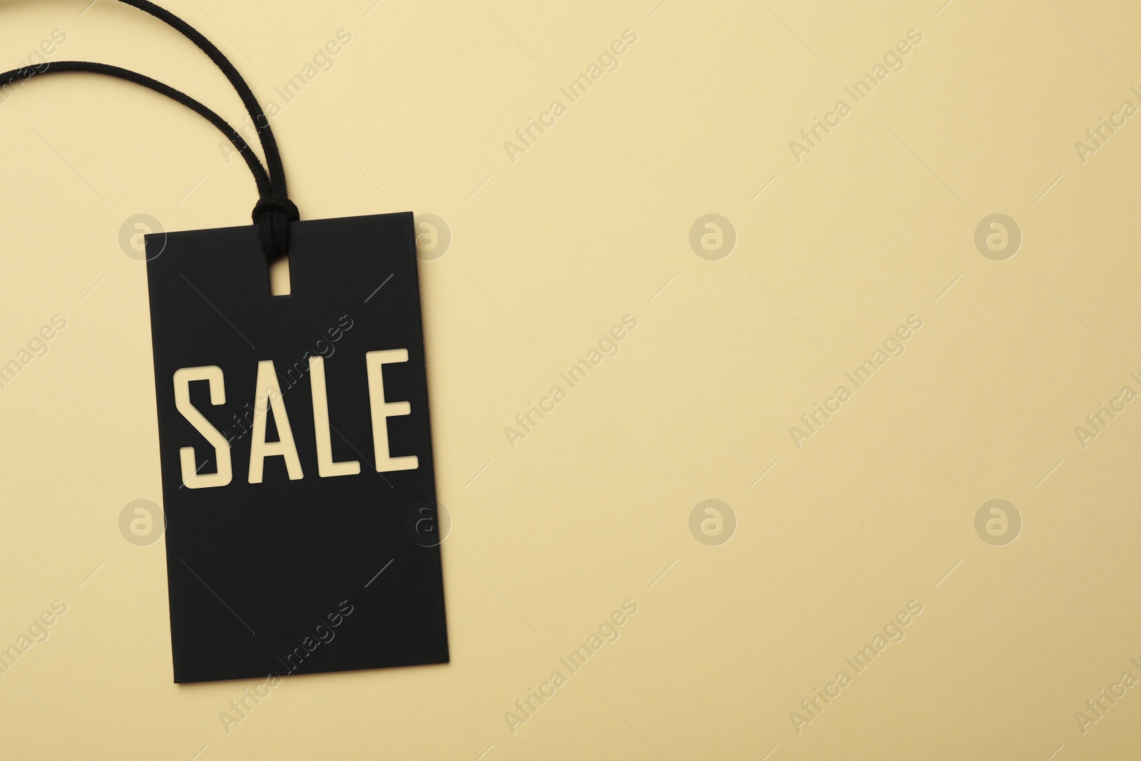 Image of Top view of tag with inscription SALE on color background, space for text. Black Friday 