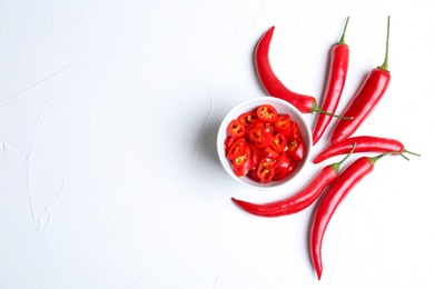 Photo of Flat lay composition with chili peppers on white background