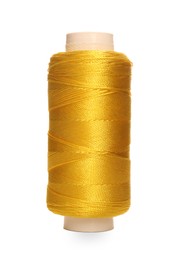 Spool of yellow sewing thread isolated on white