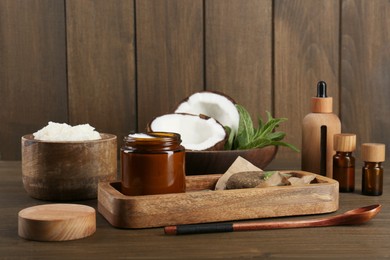 Photo of Homemade cosmetic products and fresh ingredients on wooden table