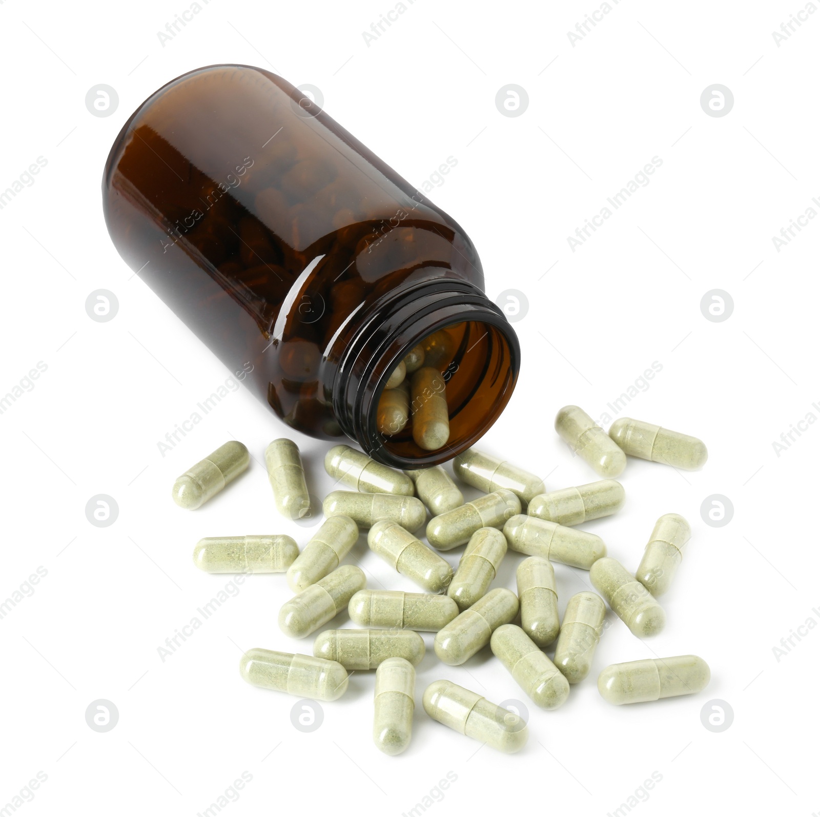 Photo of Scattered vitamin capsules and bottle isolated on white