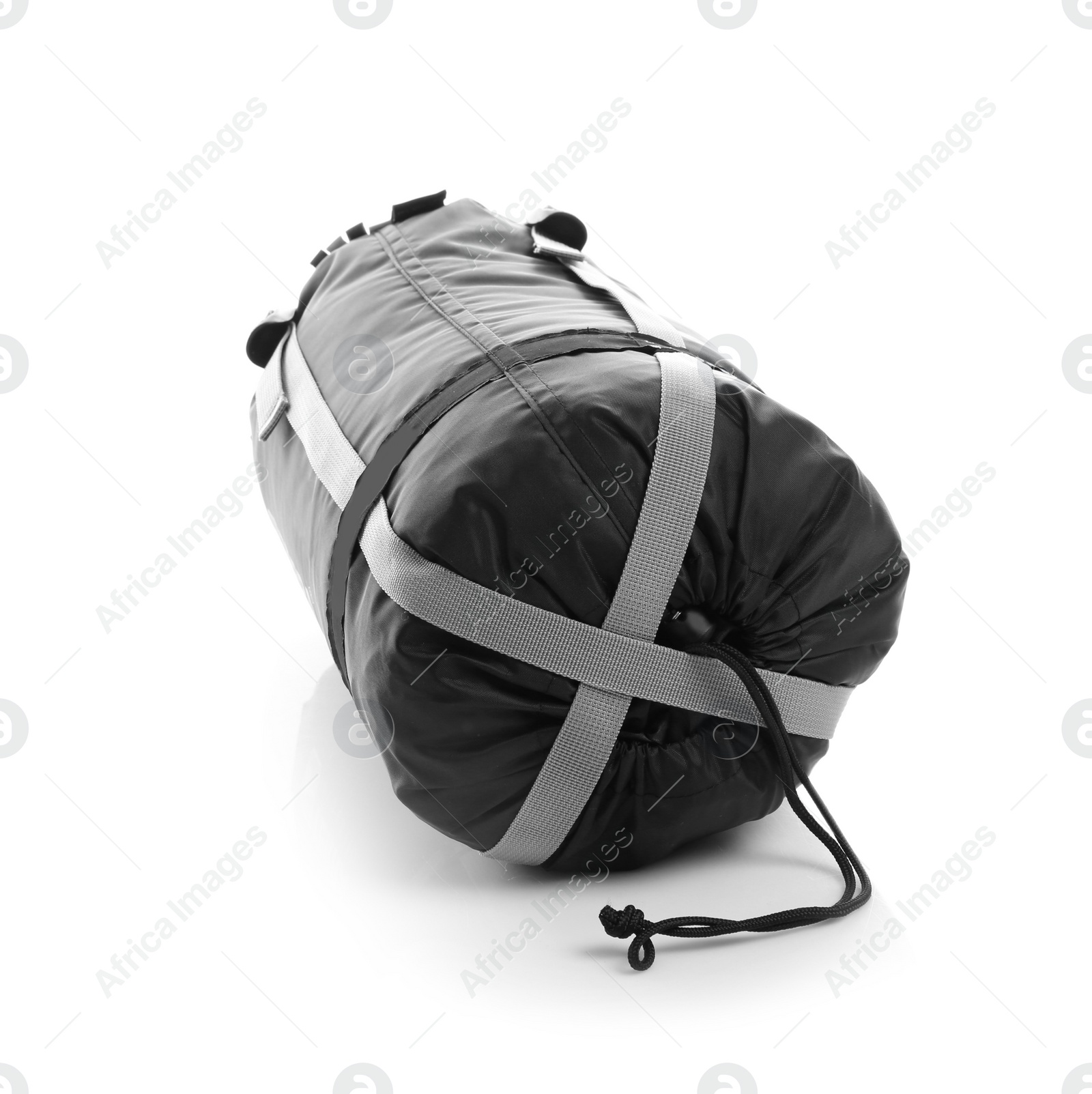 Photo of Sleeping bag in case on white background. Camping equipment