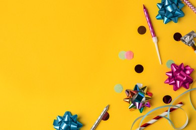 Photo of Different festive decor on orange background, flat lay