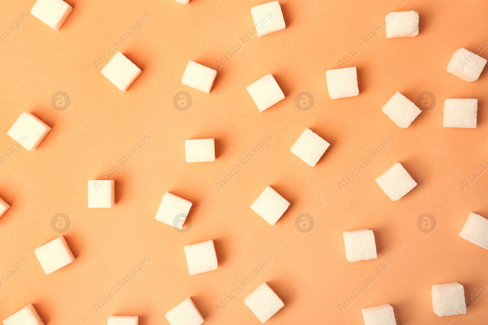 Photo of Sweet lump sugar on color background