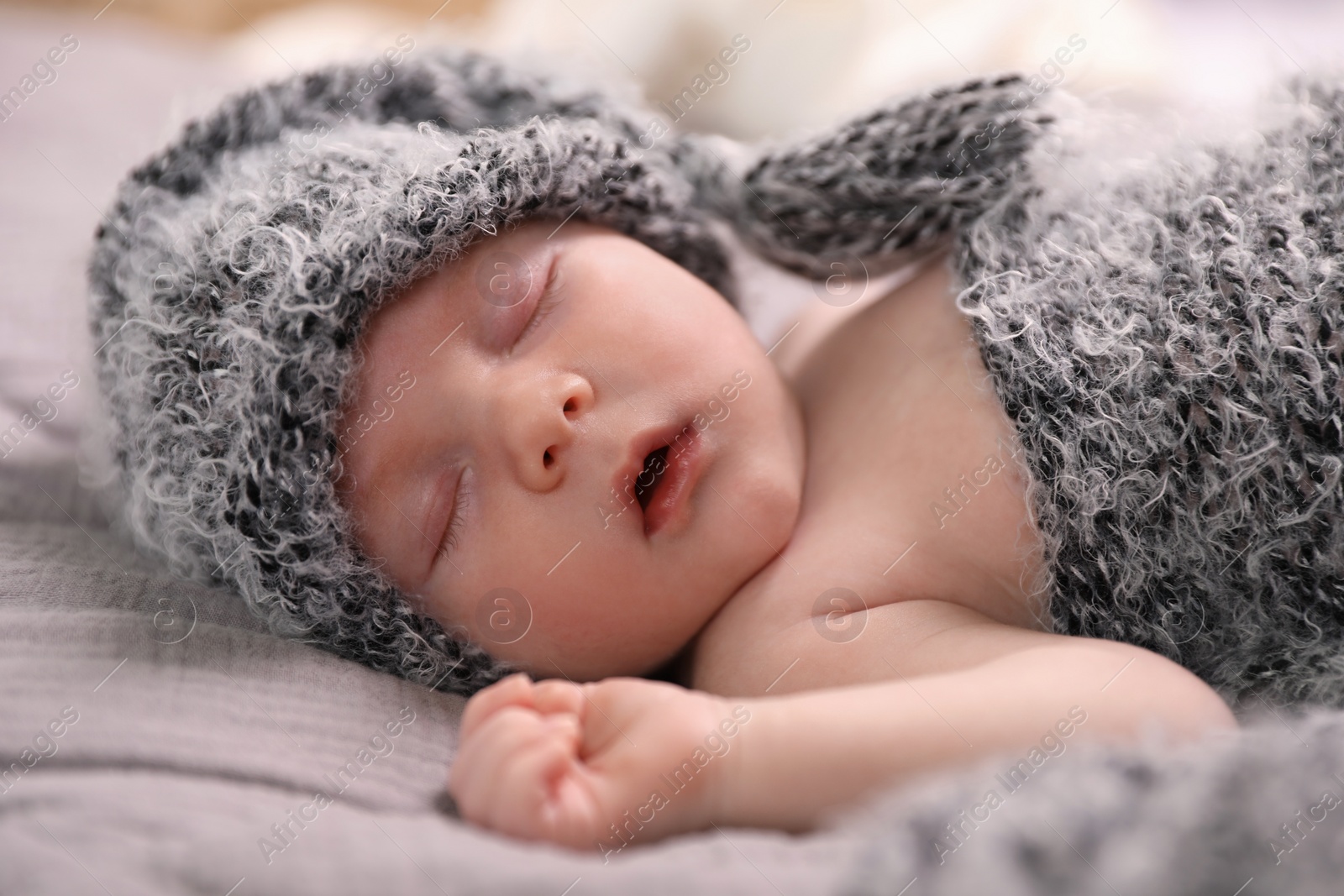 Photo of Cute newborn baby sleeping in bed, closeup