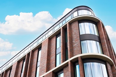 Beautiful modern building against blue sky, low angle view