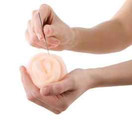 Photo of Woman needle felting from wool on white background, closeup