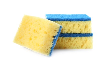 Photo of Yellow cleaning sponges with abrasive light blue scourers on white background