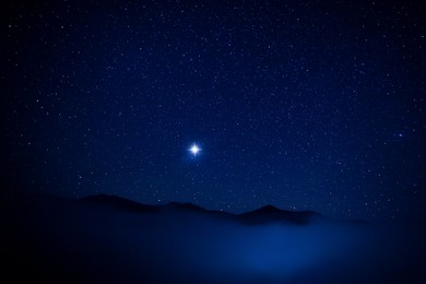 Image of Mountains under beautiful starry sky at night