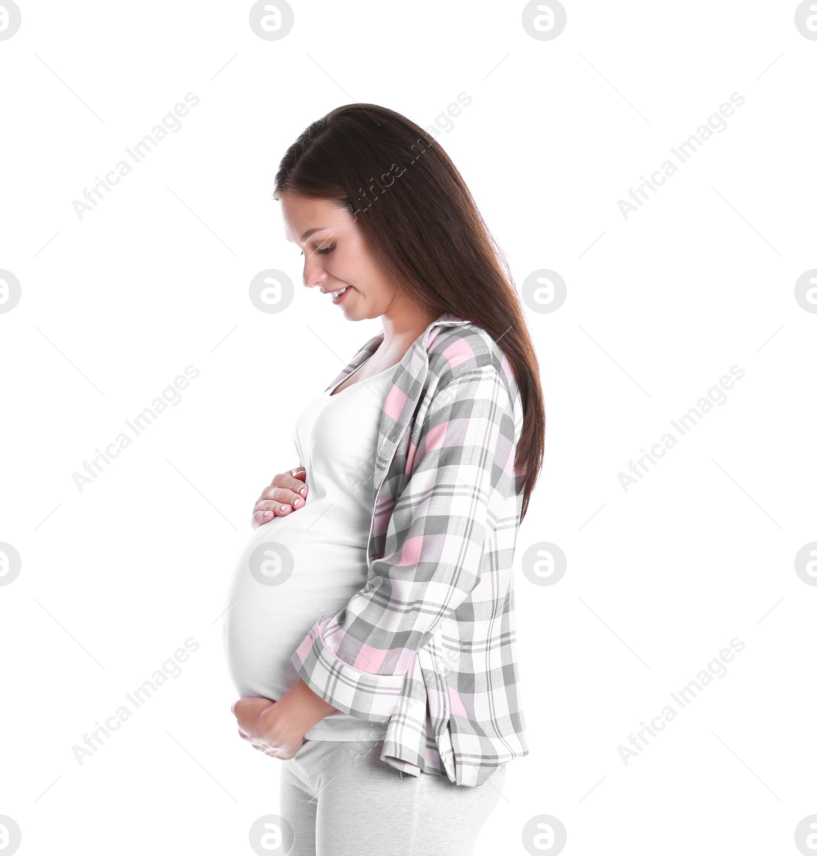 Photo of Happy pregnant woman posing on white background