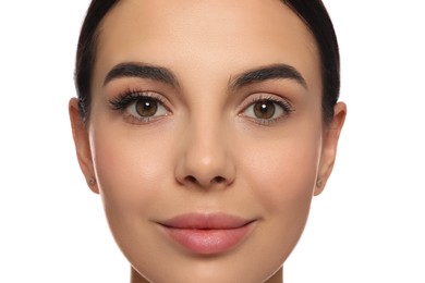 Beautiful young woman showing extended and ordinary eyelashes on white background, closeup