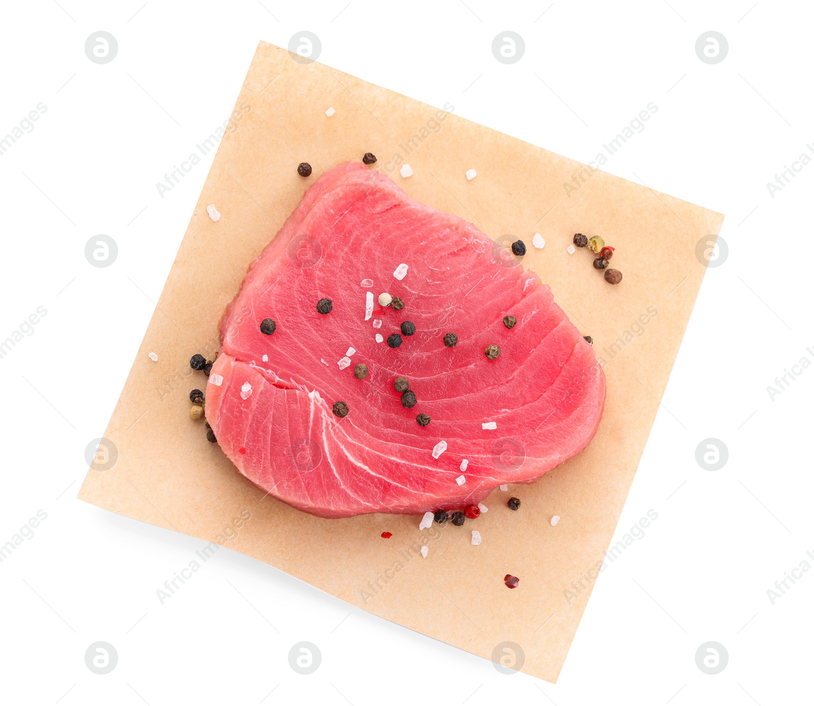 Photo of Raw tuna fillet and peppercorns on white background, top view