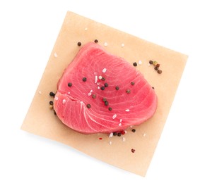 Raw tuna fillet and peppercorns on white background, top view