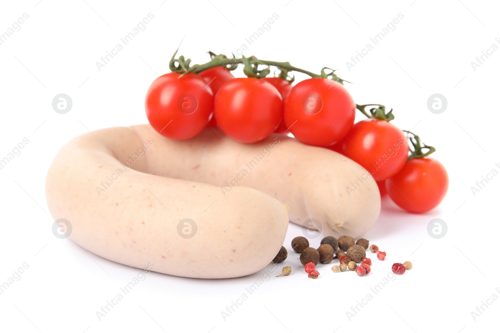 Photo of Delicious liverwurst with cherry tomatoes and spices on white background