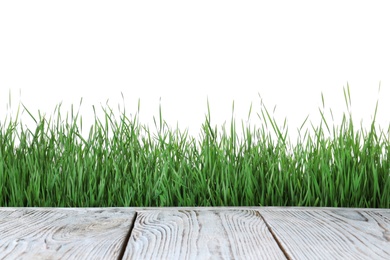 Photo of Wooden deck and green grass isolated on white