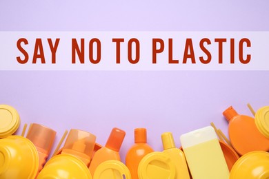 Image of Text SAY NO TO PLASTIC and disposable items on lilac background, flat lay