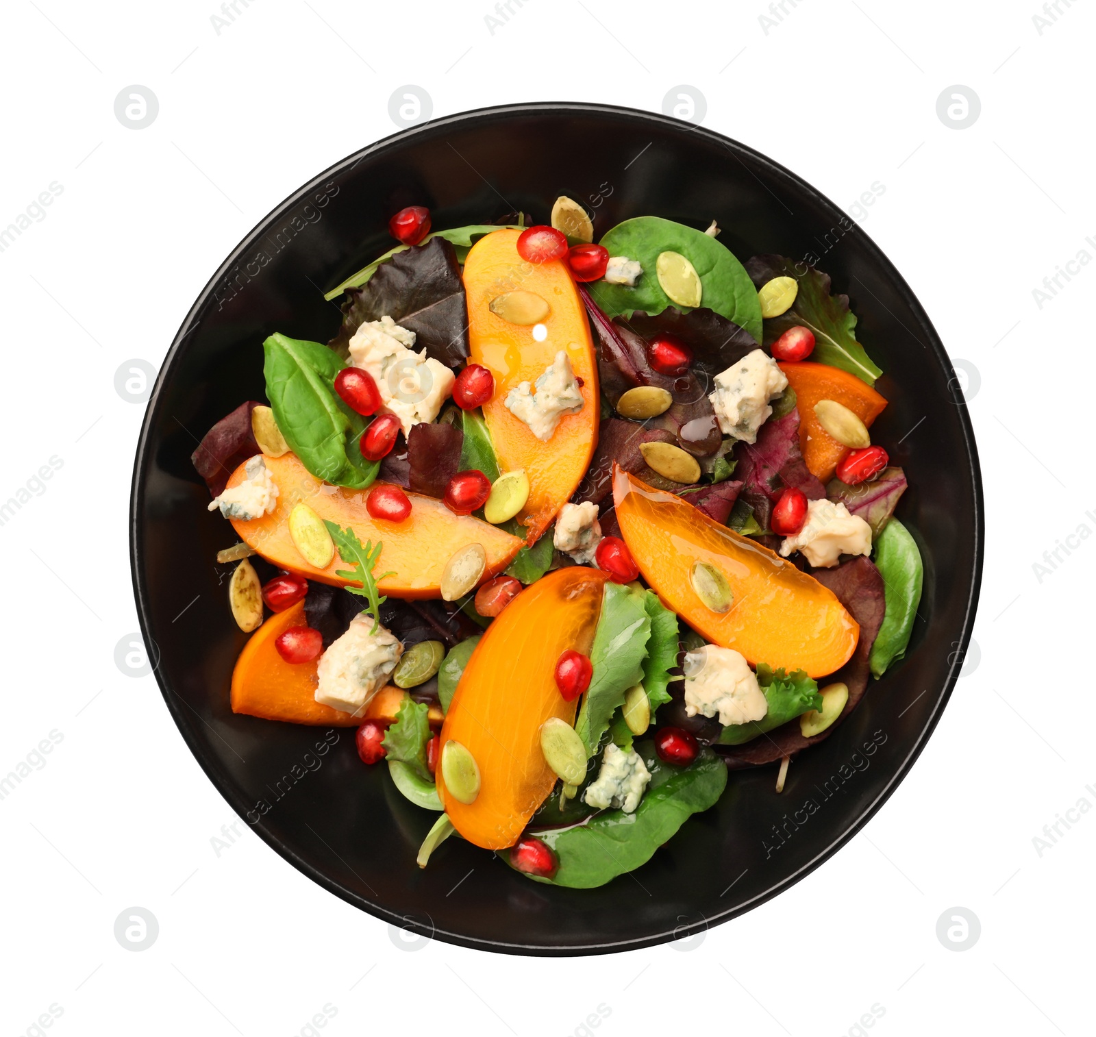 Photo of Delicious persimmon salad with pomegranate and spinach isolated on white, top view