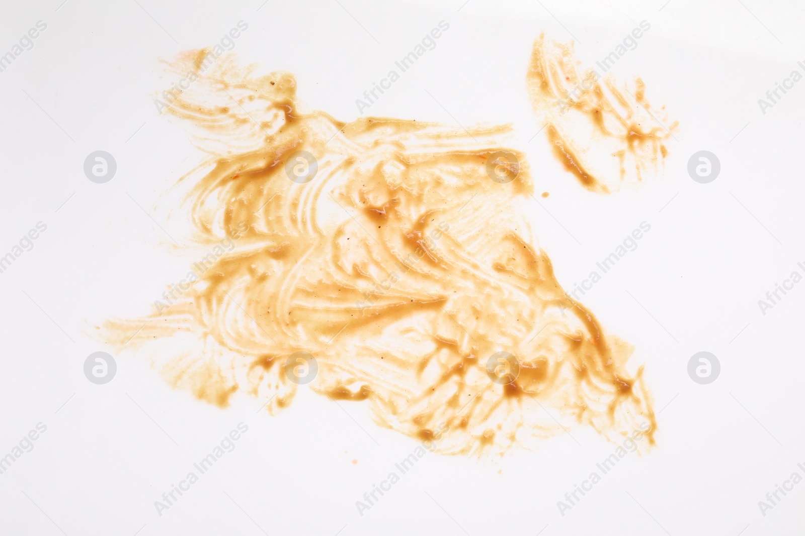 Photo of Smear of sauce on white background, top view