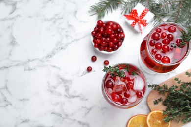 Photo of Flat lay composition with delicious Christmas liqueur on white marble table, space for text