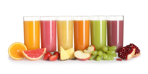 Photo of Glasses with different juices and fresh fruits on white background