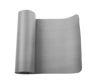 Photo of Rolled grey yoga mat on white background