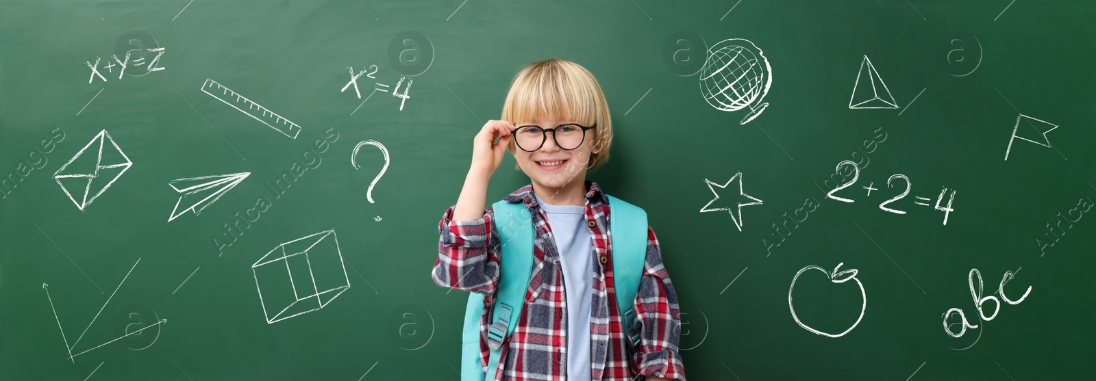 Image of School boy near green chalkboard with drawings and inscriptions, banner design