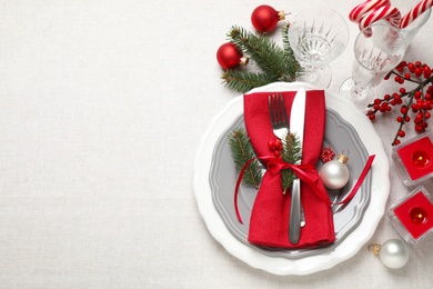 Photo of Festive table setting with beautiful dishware and Christmas decor on white background, flat lay. Space for text