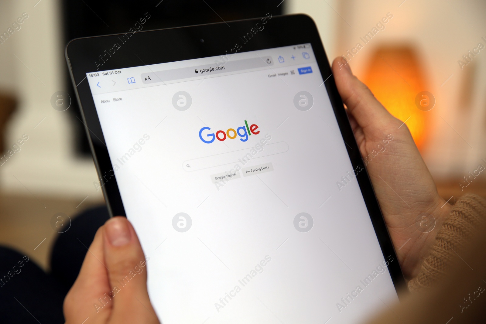 Photo of MYKOLAIV, UKRAINE - OCTOBER 31, 2020: Woman using Google search engine on tablet indoors, closeup