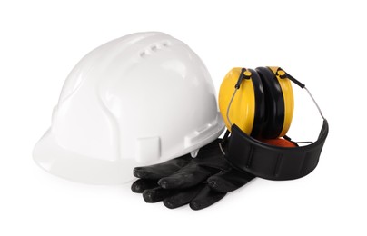 Hard hat, earmuffs and gloves isolated on white. Safety equipment