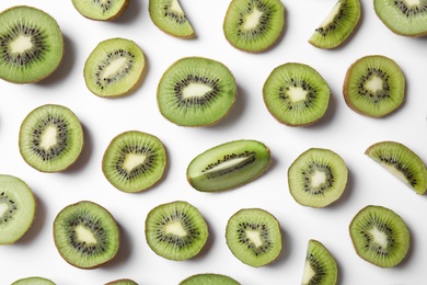 Photo of Top view of sliced kiwis on white background