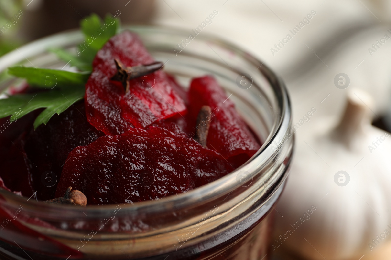 Photo of Delicious pickled beets in jar, closeup view