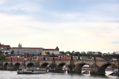 Photo of PRAGUE, CZECH REPUBLIC - APRIL 25, 2019: Cityscape with  Charles Bridge on Vltava river