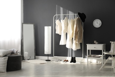 Dressing room interior with clothing rack and mirror