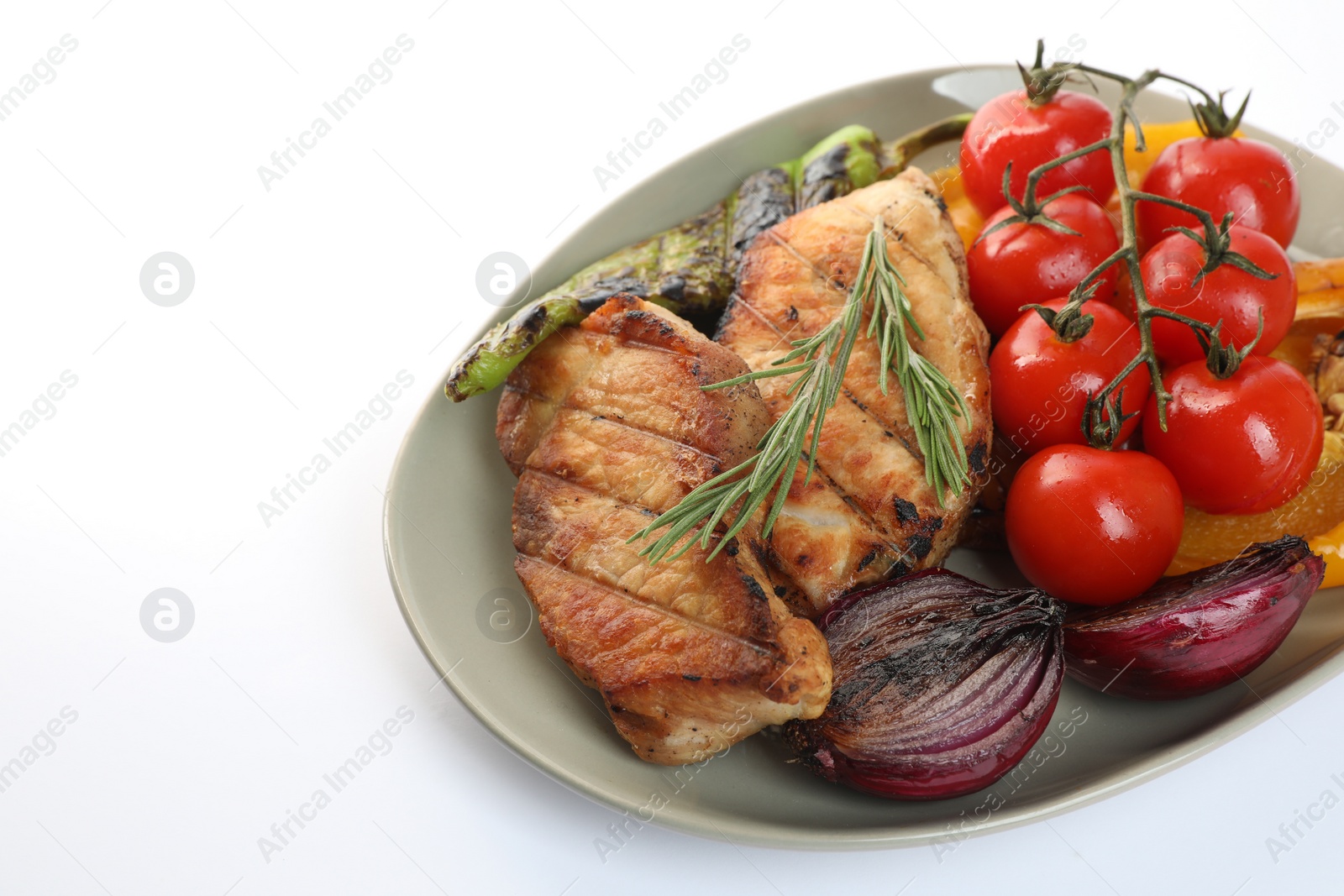 Photo of Plate with tasty grilled vegetables, meat, fresh cherry tomatoes and rosemary isolated on white