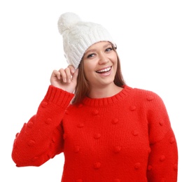 Photo of Young woman in warm sweater and hat on white background. Winter season