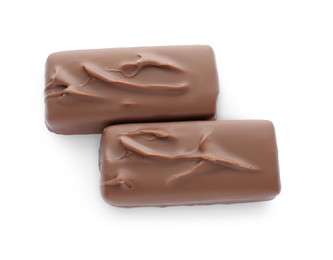 Photo of Tasty chocolate bars on white background, top view