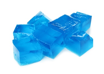 Heap of blue jelly cubes on white background