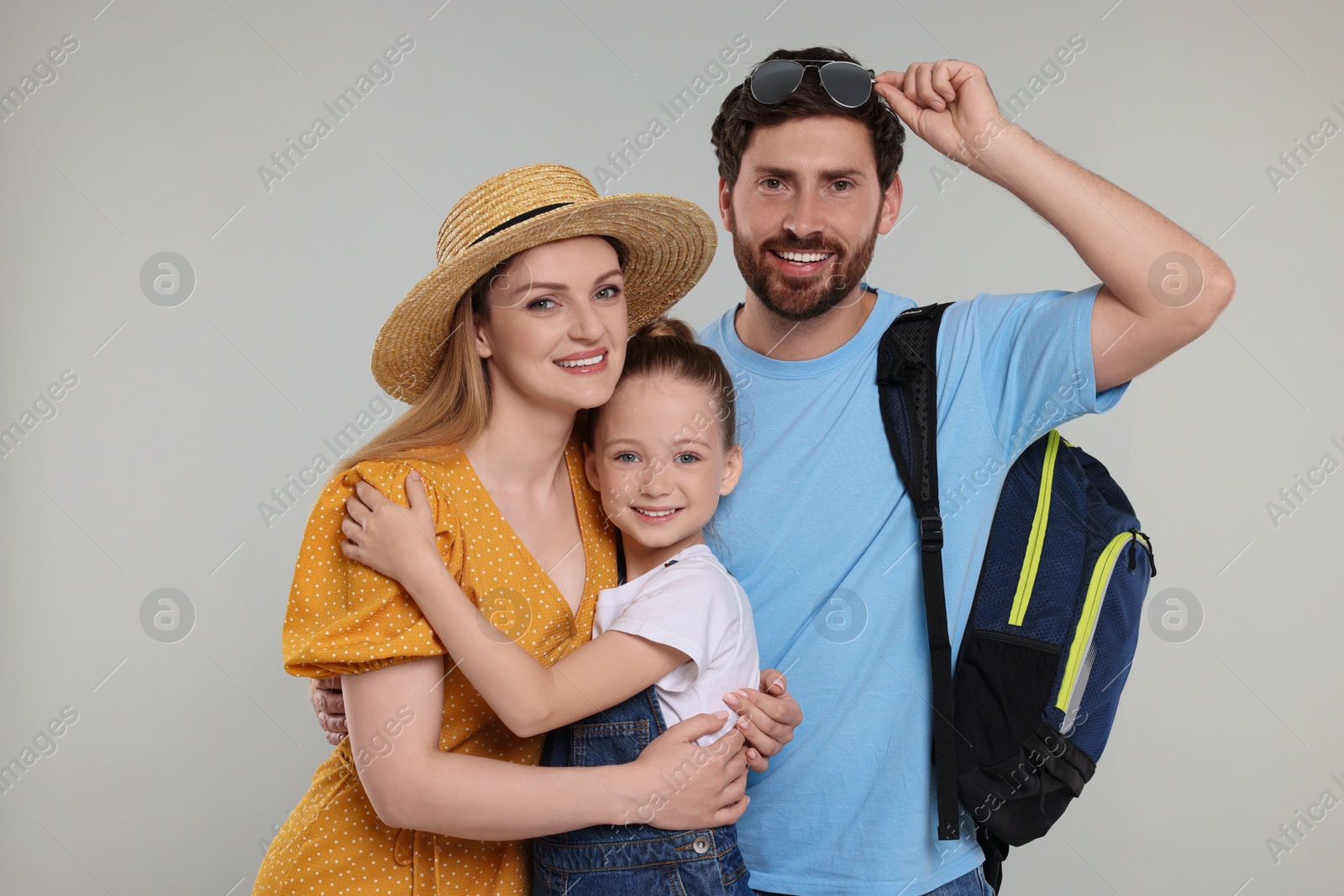 Photo of Portrait of happy family on light grey background