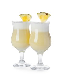 Tasty Pina Colada cocktail on white background