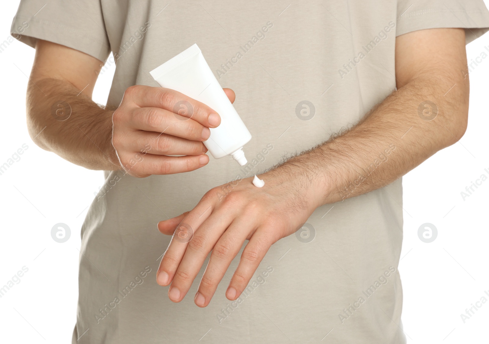 Photo of Man applying cream onto hand against white background, closeup