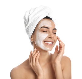 Happy young woman with organic mask on her face against white background