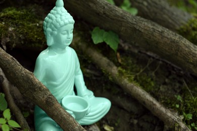 Photo of Decorative Buddha statue near tree outdoors. Space for text